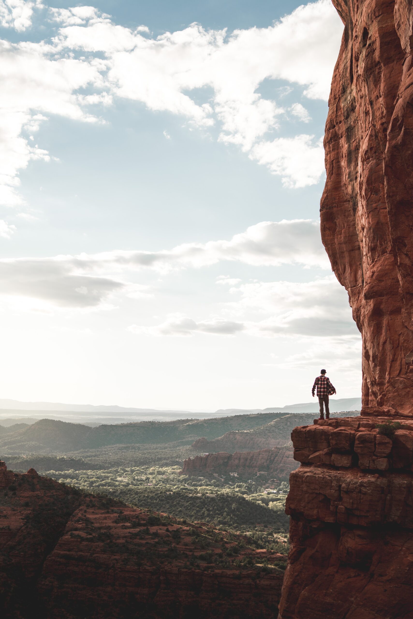 Man on side of mountain contemplating the commitment to change