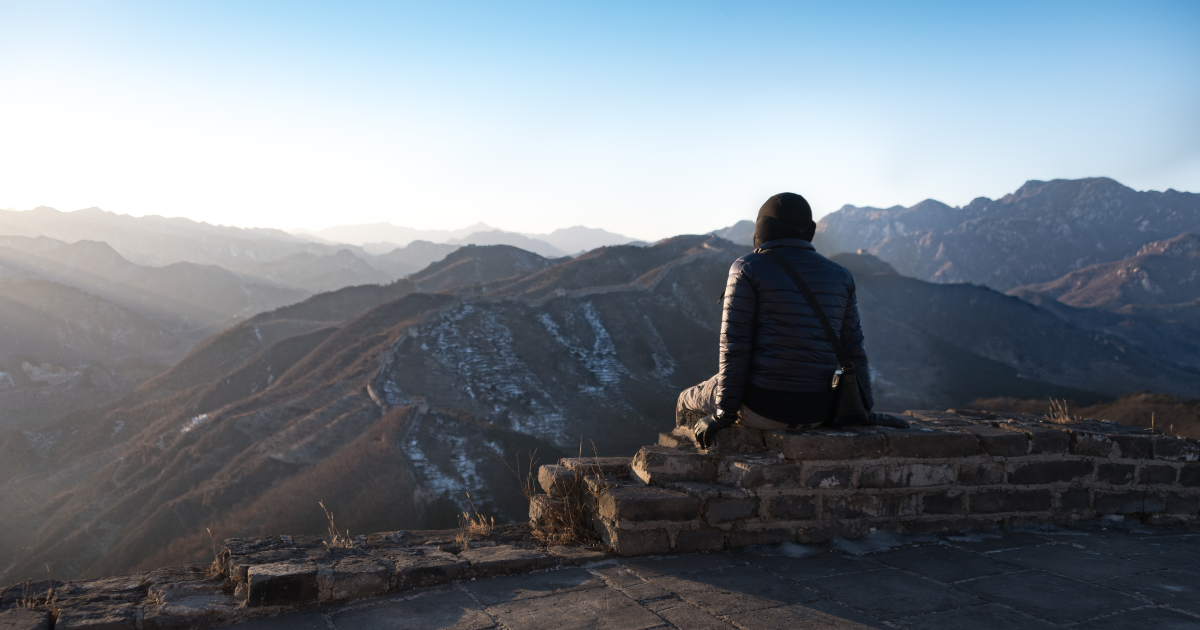 Individual deep in thought, representing the contemplation stage of change